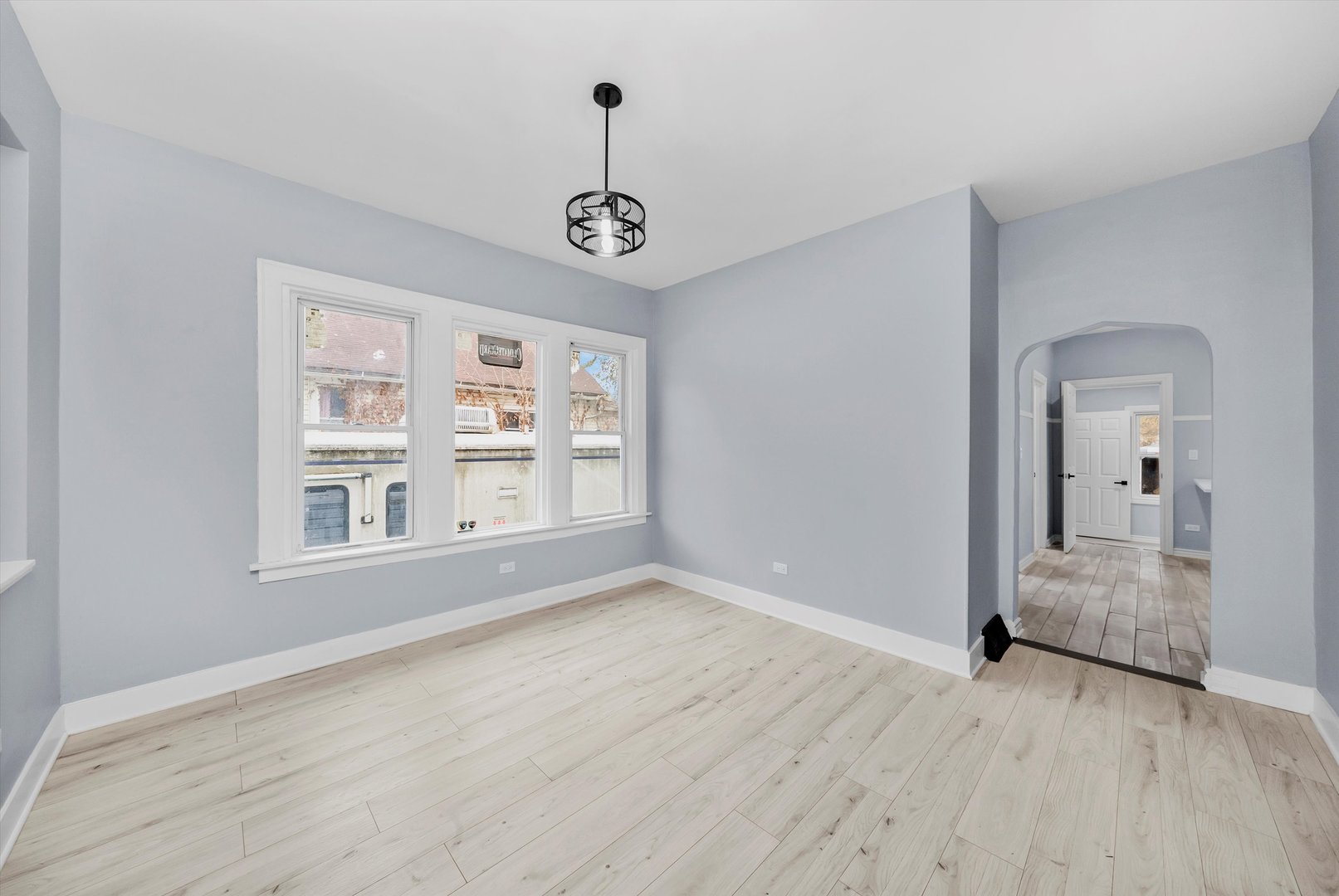 11730 South Perry Avenue Chicago, IL 60628 - Photo 8 of 25 a view of livingroom with hardwood floor and window