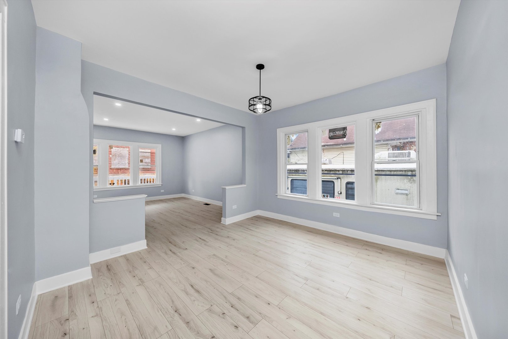 11730 South Perry Avenue Chicago, IL 60628 - Photo 9 of 25 wooden floor in an empty room with a window