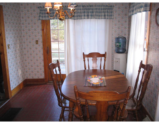 839 Boston Road Billerica, MA 01821 - Photo 3 of 6 a view of a dining room with furniture and wooden floor