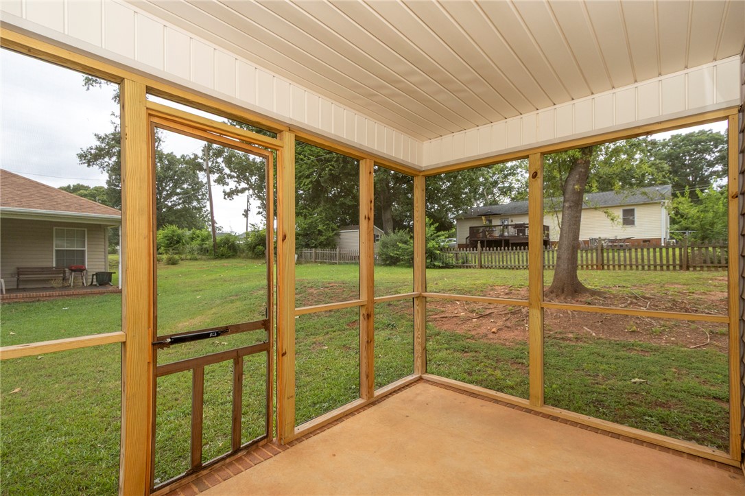 2509 Rolling Green Road Anderson, SC 29621 - Photo 25 of 28 A screened porch with a durable concrete floor offers tranquil views of the spacious private yard.