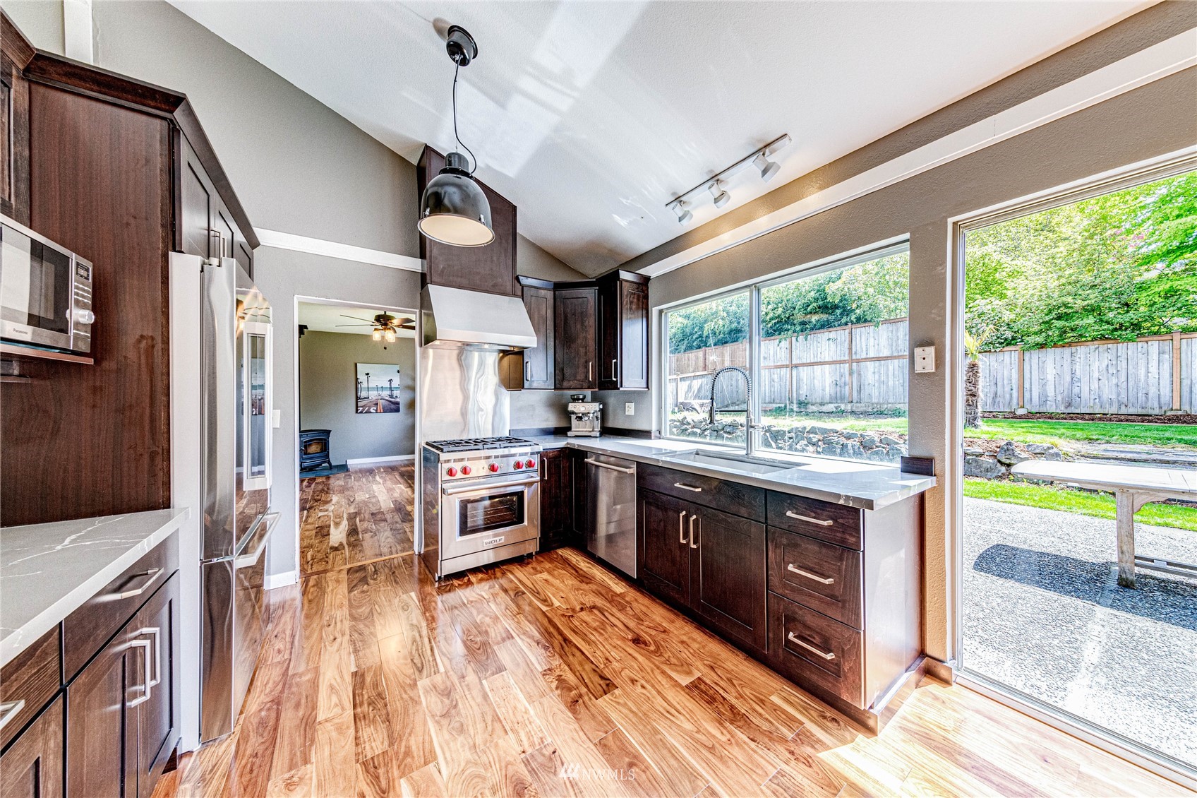 612 221st Street Southwest Bothell, WA 98021 - Photo 8 of 26 a kitchen with stainless steel appliances granite countertop sink stove and refrigerator