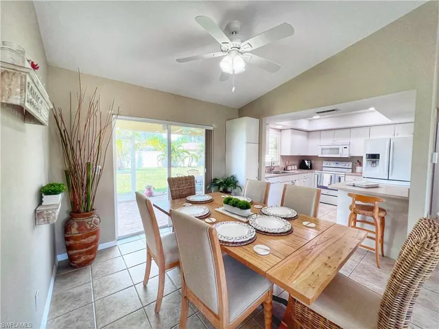 a kitchen with a table and chairs