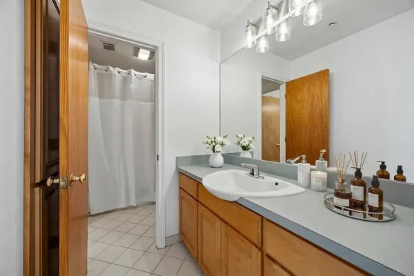 a bathroom with a sink double vanity and a mirror