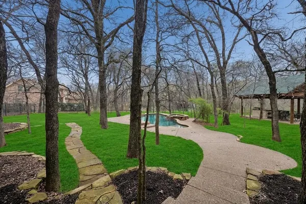 a view of a park with large trees