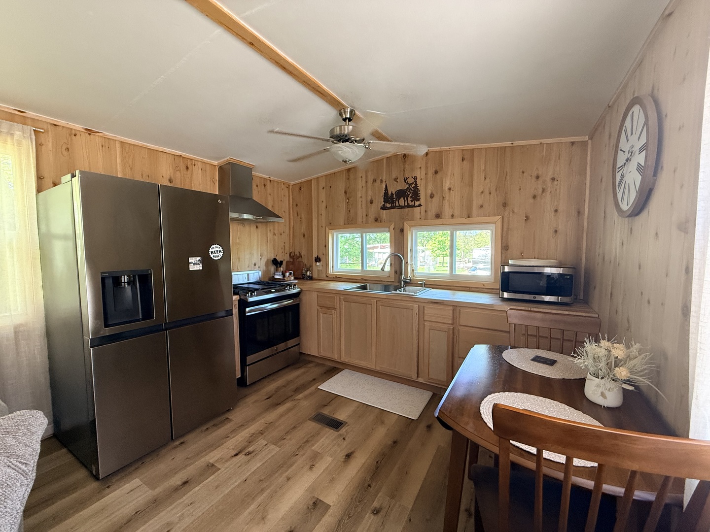25-4 Woodhaven Lakes Sublette, IL 61367 - Photo 14 of 26 a kitchen with granite countertop a refrigerator a stove a sink and a window