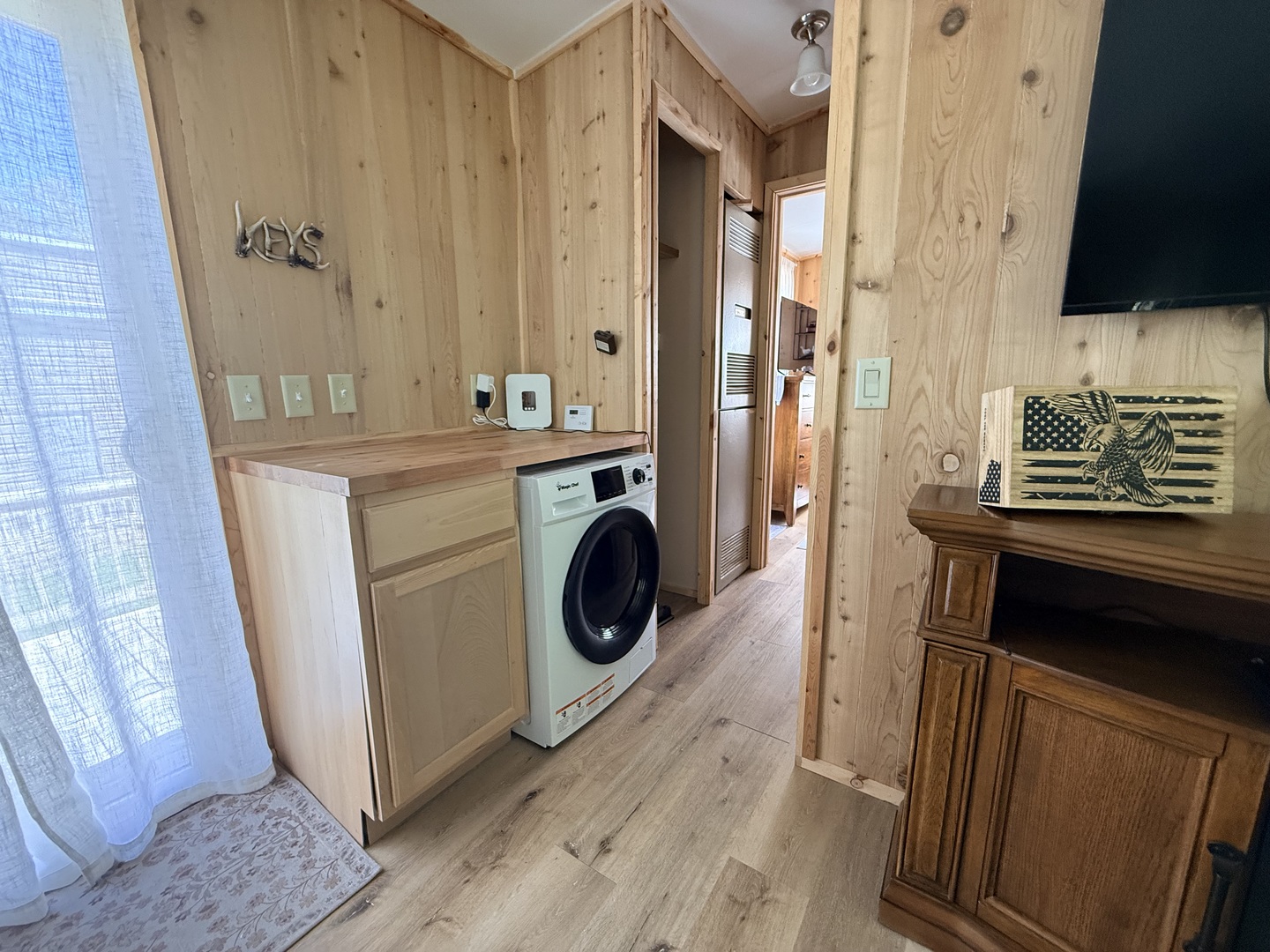25-4 Woodhaven Lakes Sublette, IL 61367 - Photo 19 of 26 a view of a hallway with washer and dryer