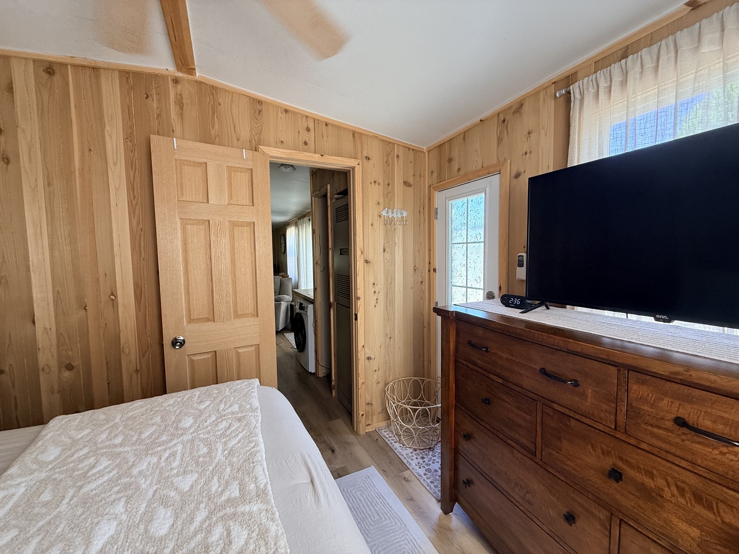 25-4 Woodhaven Lakes Sublette, IL 61367 - Photo 22 of 26 a bedroom with a bed and a flat tv screen on dresser