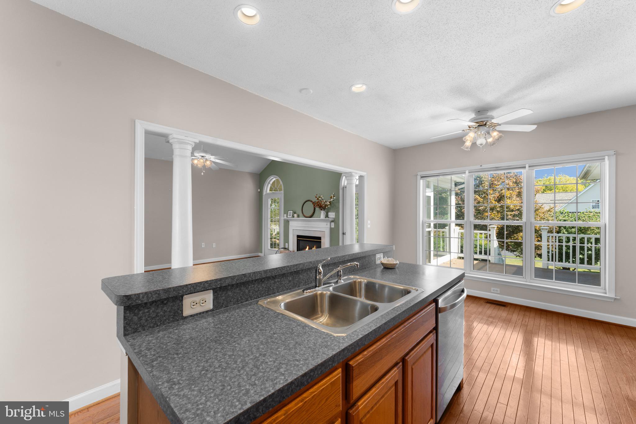 19065 Stallion Road Culpeper, VA 22701 - Photo 18 of 40 a kitchen with granite countertop a sink and a window