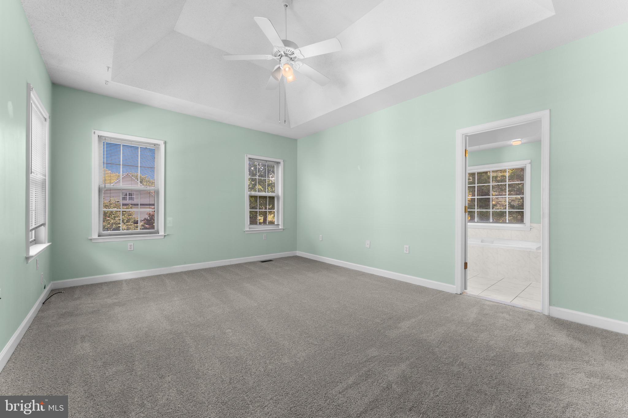 19065 Stallion Road Culpeper, VA 22701 - Photo 23 of 40 an empty room with windows and fan