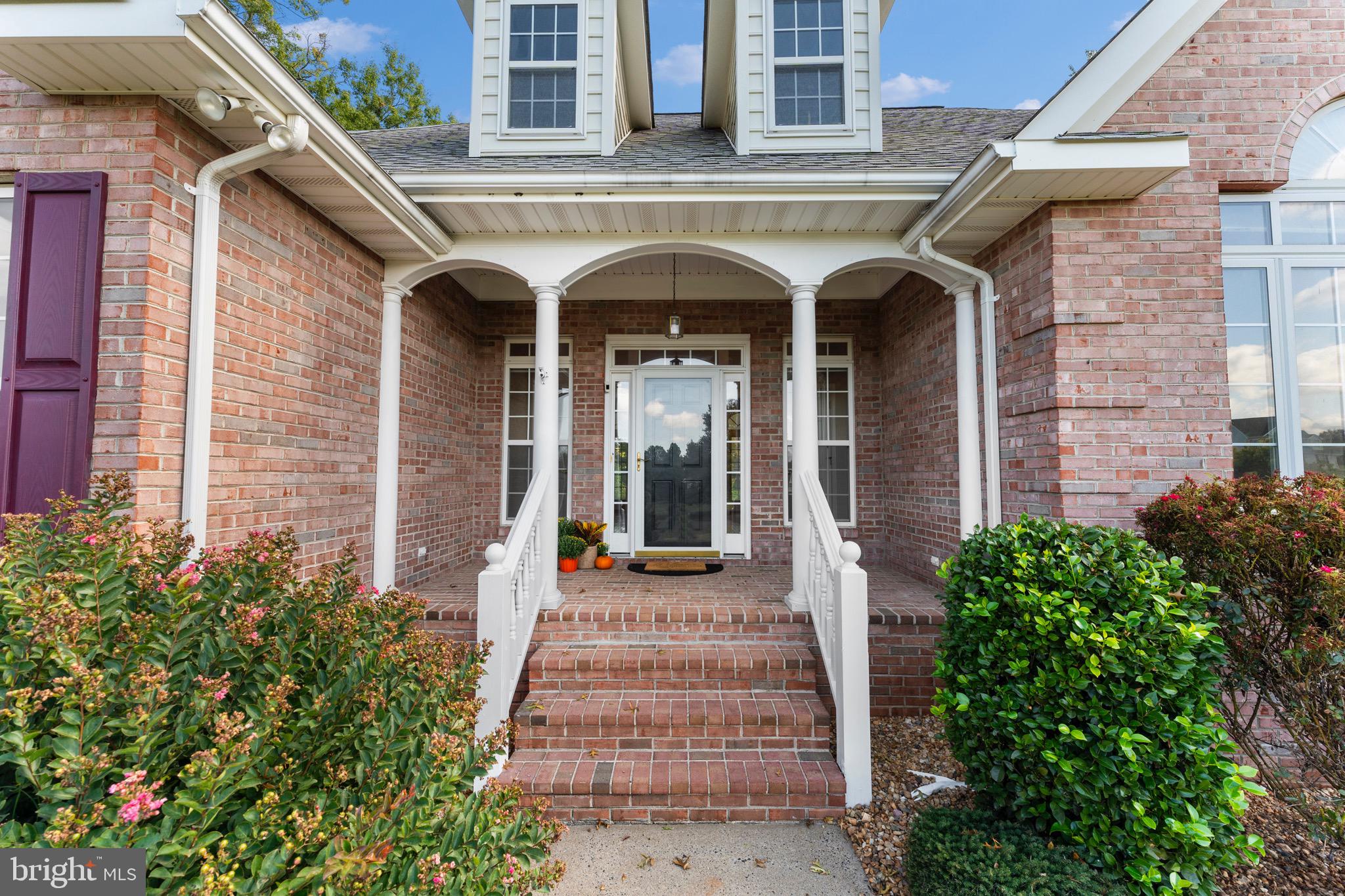 19065 Stallion Road Culpeper, VA 22701 - Photo 3 of 40 a front view of a house with potted plants