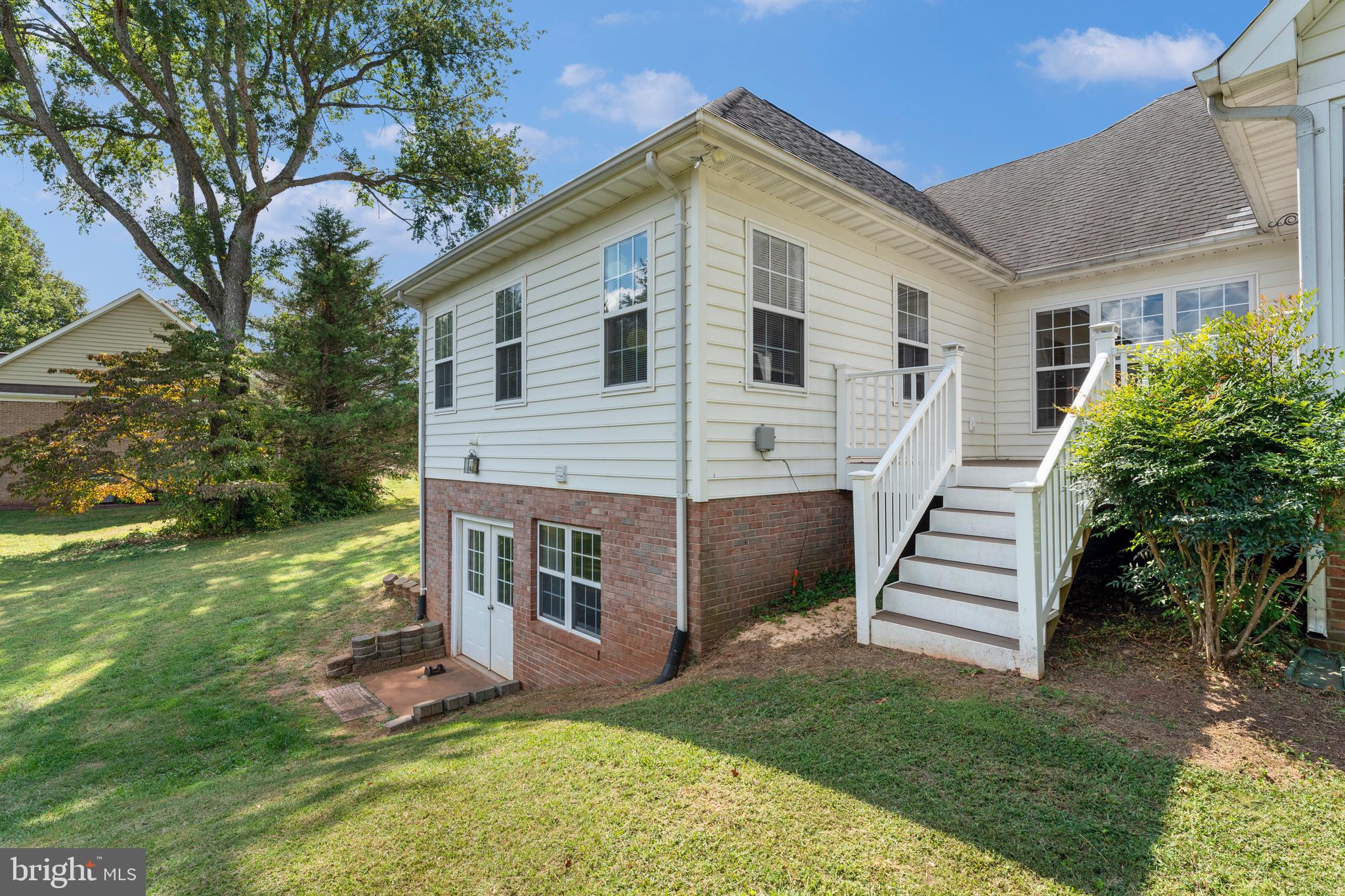 19065 Stallion Road Culpeper, VA 22701 - Photo 39 of 40 a view of a house with a yard