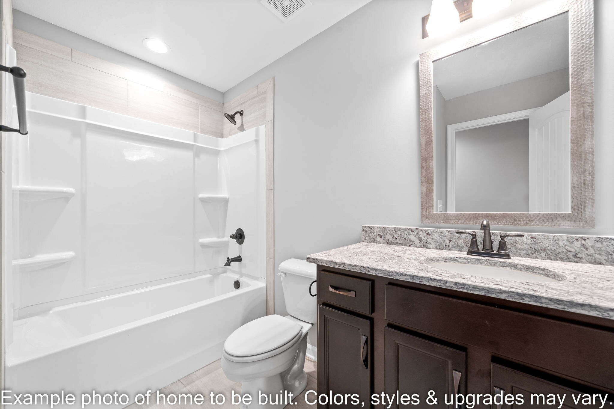 929 Inverness Lane Clarksville, TN 37043 - Photo 30 of 42 a bathroom with a granite countertop sink toilet a large mirror a bathtub and shower