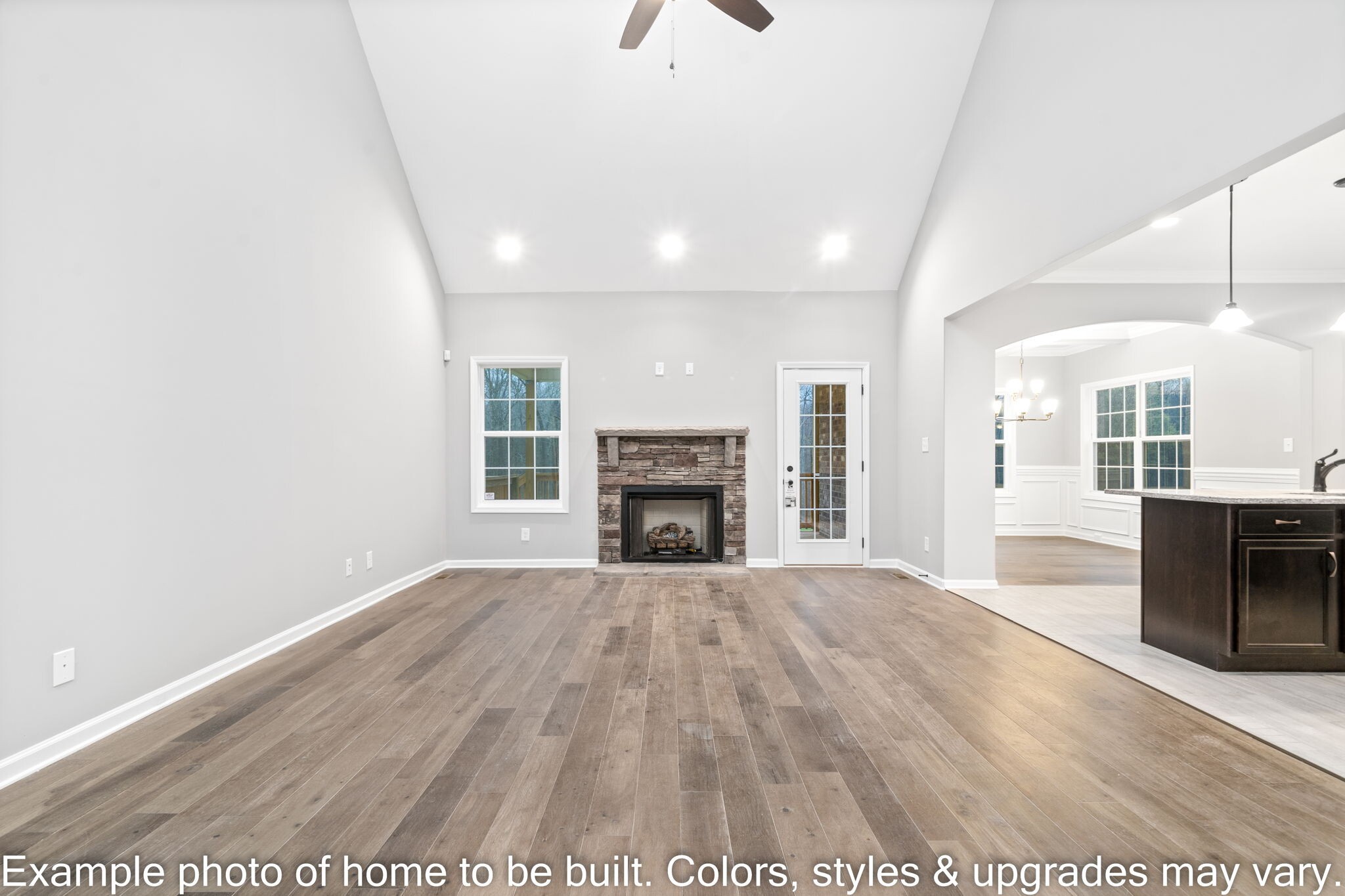 929 Inverness Lane Clarksville, TN 37043 - Photo 7 of 42 a view of an empty room with wooden floor fireplace and a window