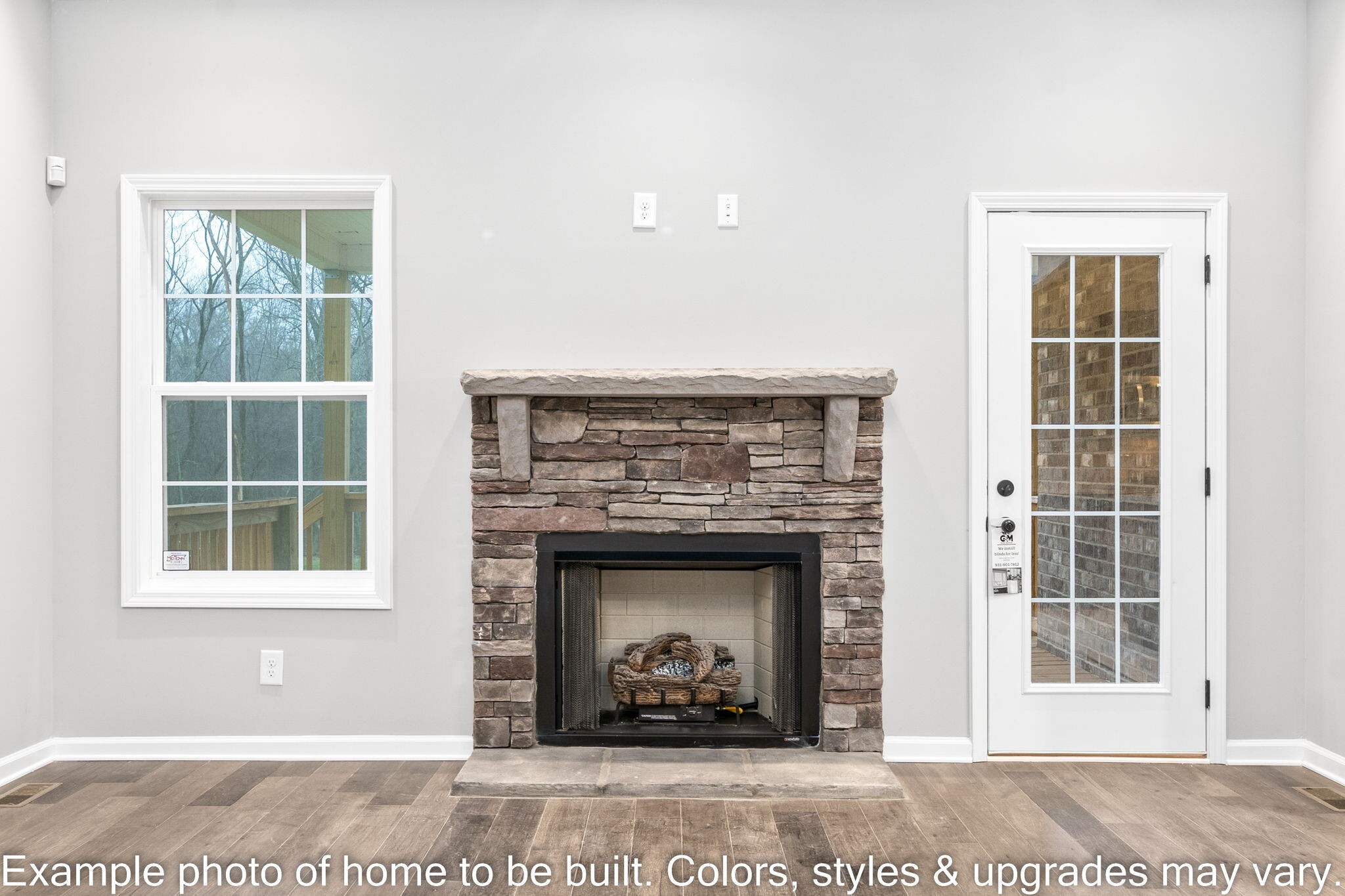 929 Inverness Lane Clarksville, TN 37043 - Photo 8 of 42 a living room with a fireplace and a window