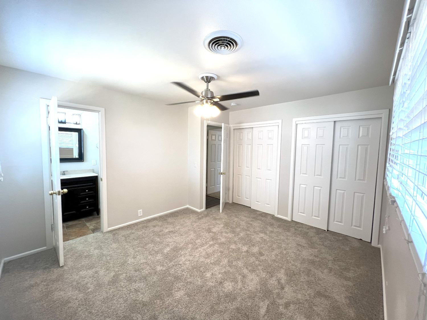 4214 54th Street Lubbock, TX 79413 - Photo 12 of 18 wooden floor in an empty room with a window
