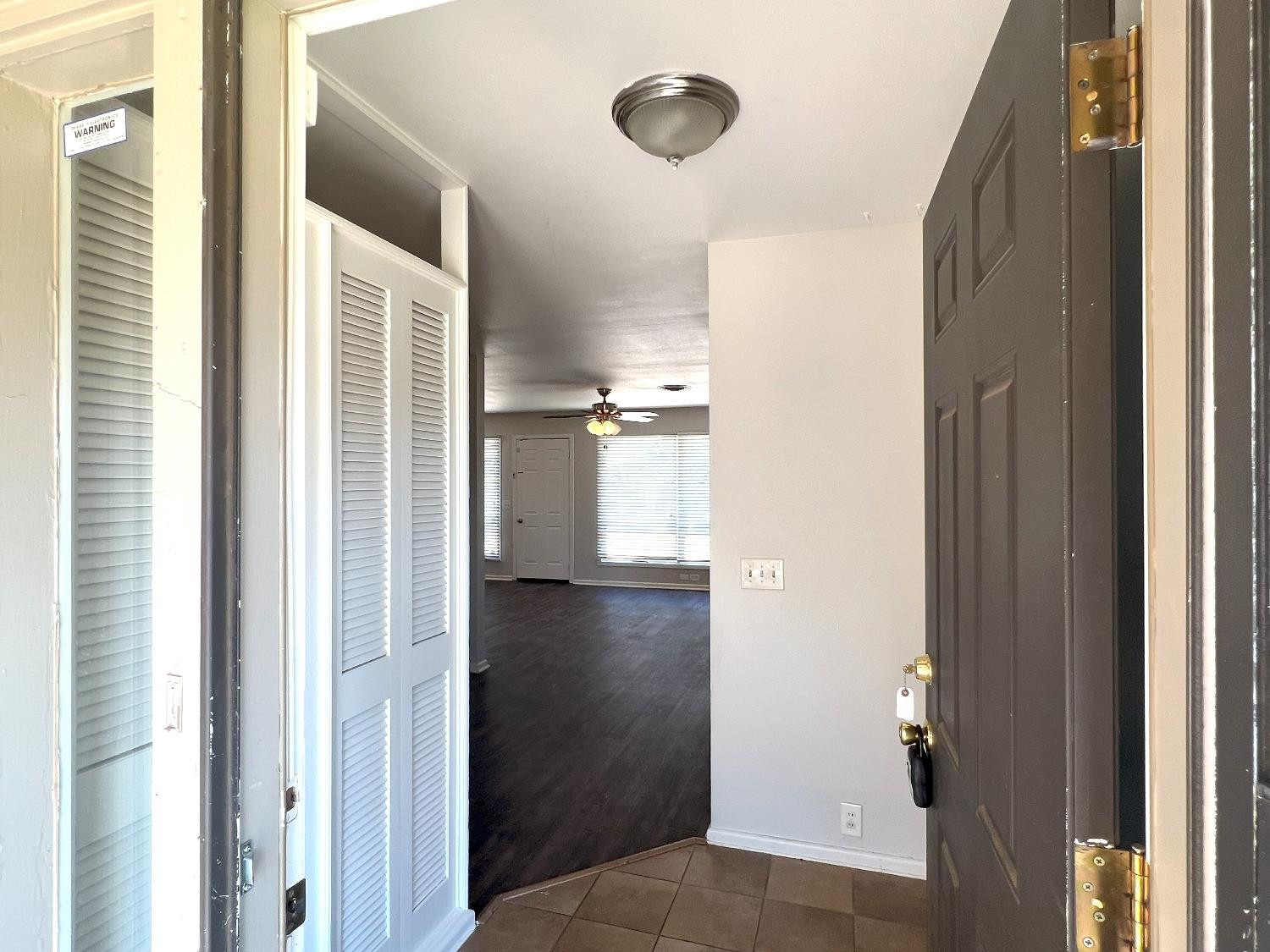 4214 54th Street Lubbock, TX 79413 - Photo 2 of 18 a view of a kitchen from the hallway