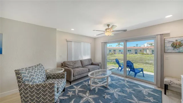 a bedroom with a bed and a ceiling fan
