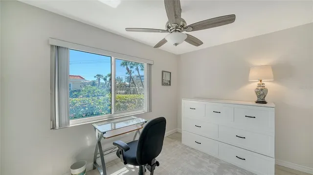 a view of a swimming pool and lounge chairs
