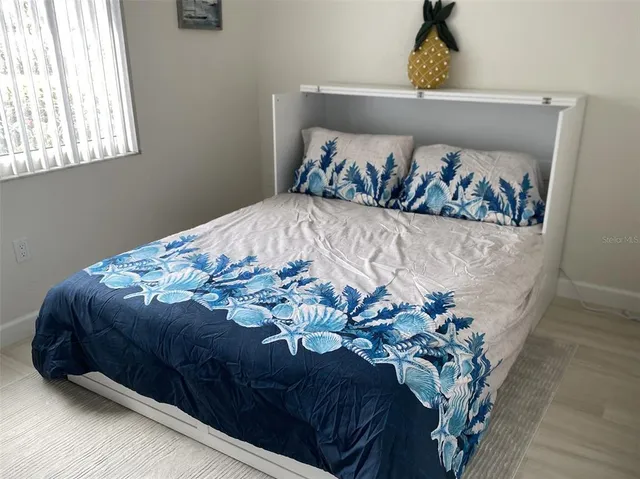 a view of a house with backyard porch and sitting area