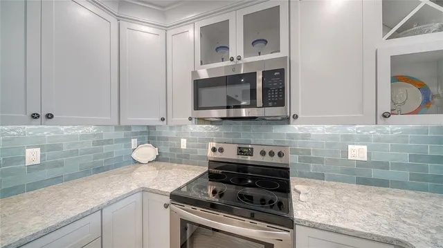 a view of a dining room with furniture wooden floor and chandelier