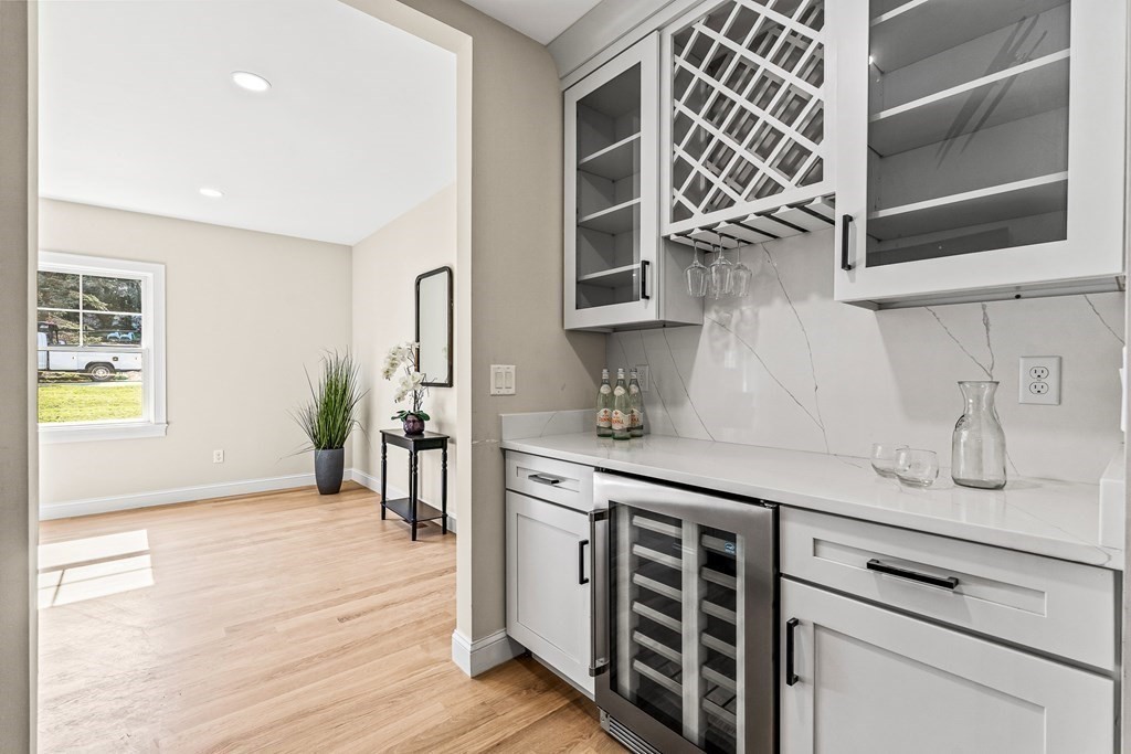 228 Ridge Street Winchester, MA 01890 - Photo 12 of 42 a kitchen with stainless steel appliances granite countertop a sink and wooden cabinets