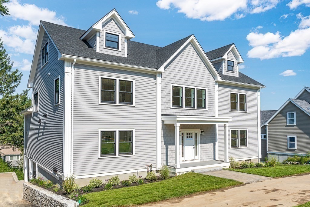 228 Ridge Street Winchester, MA 01890 - Photo 2 of 42 a front view of a house with a yard