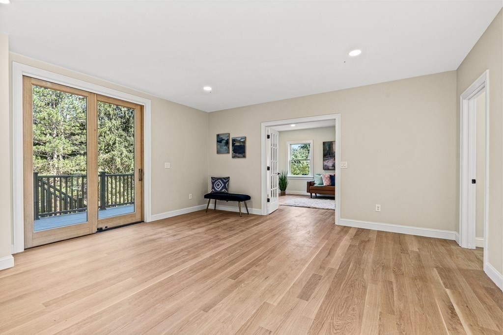 228 Ridge Street Winchester, MA 01890 - Photo 21 of 42 a view of an empty room with wooden floor and a window