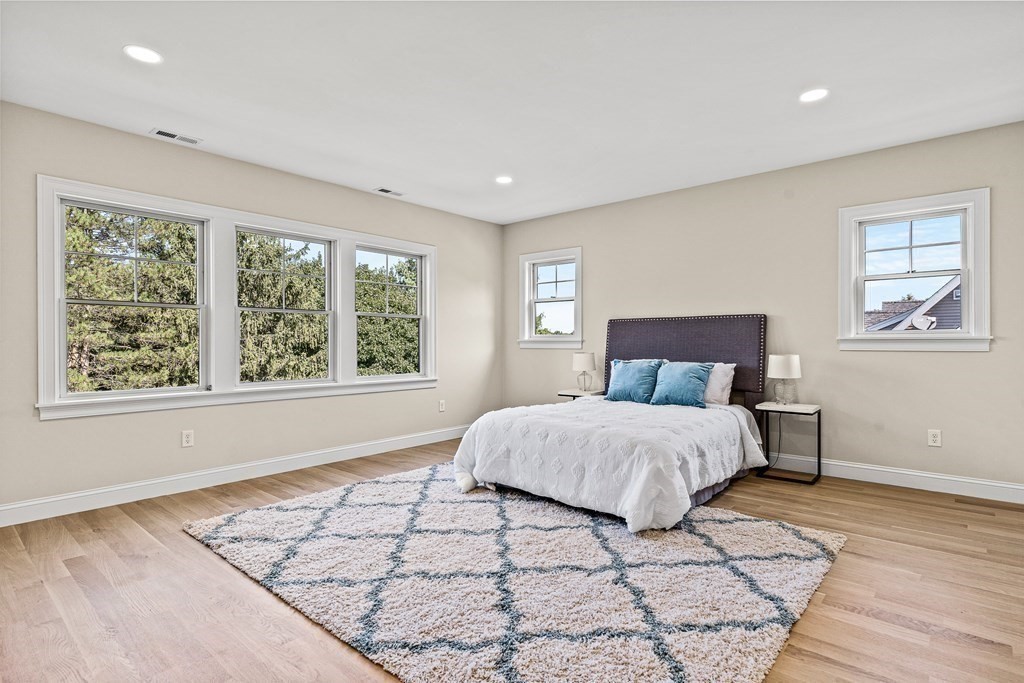 228 Ridge Street Winchester, MA 01890 - Photo 28 of 42 a bedroom with a large bed and a window
