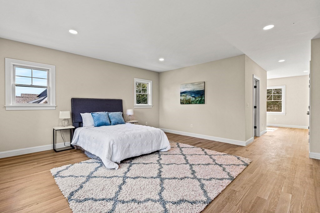 228 Ridge Street Winchester, MA 01890 - Photo 29 of 42 a bedroom with a bed and wooden floor