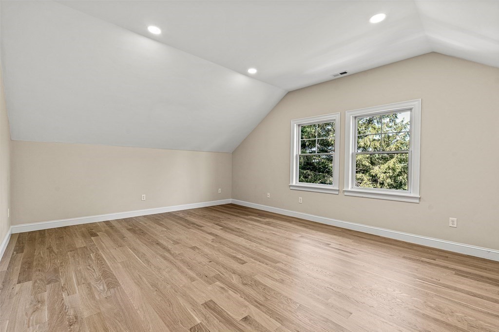 228 Ridge Street Winchester, MA 01890 - Photo 33 of 42 an empty room with wooden floor and windows