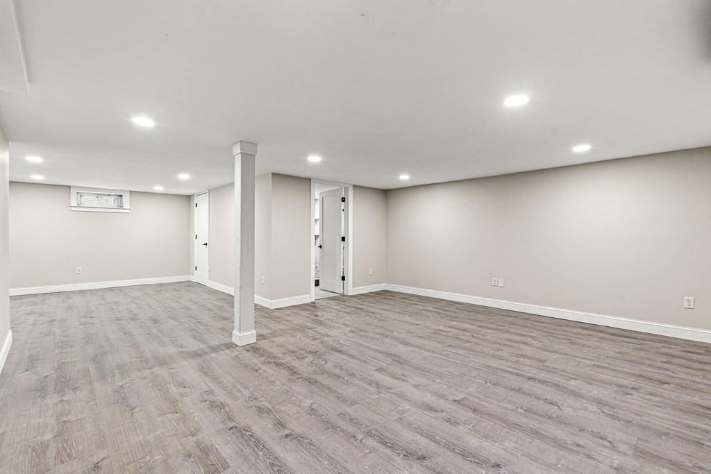 228 Ridge Street Winchester, MA 01890 - Photo 36 of 42 an empty room with wooden floor