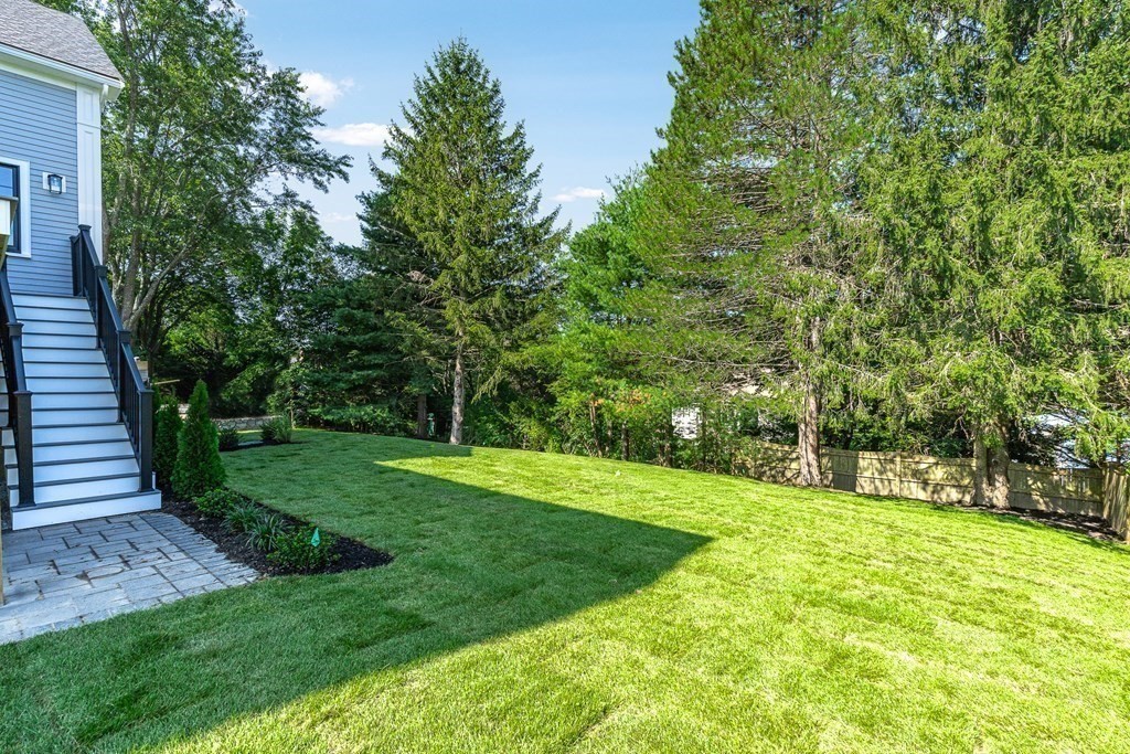 228 Ridge Street Winchester, MA 01890 - Photo 4 of 42 a view of a backyard with large trees