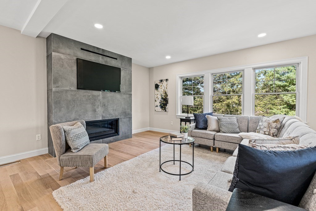 228 Ridge Street Winchester, MA 01890 - Photo 6 of 42 a living room with furniture and a fireplace