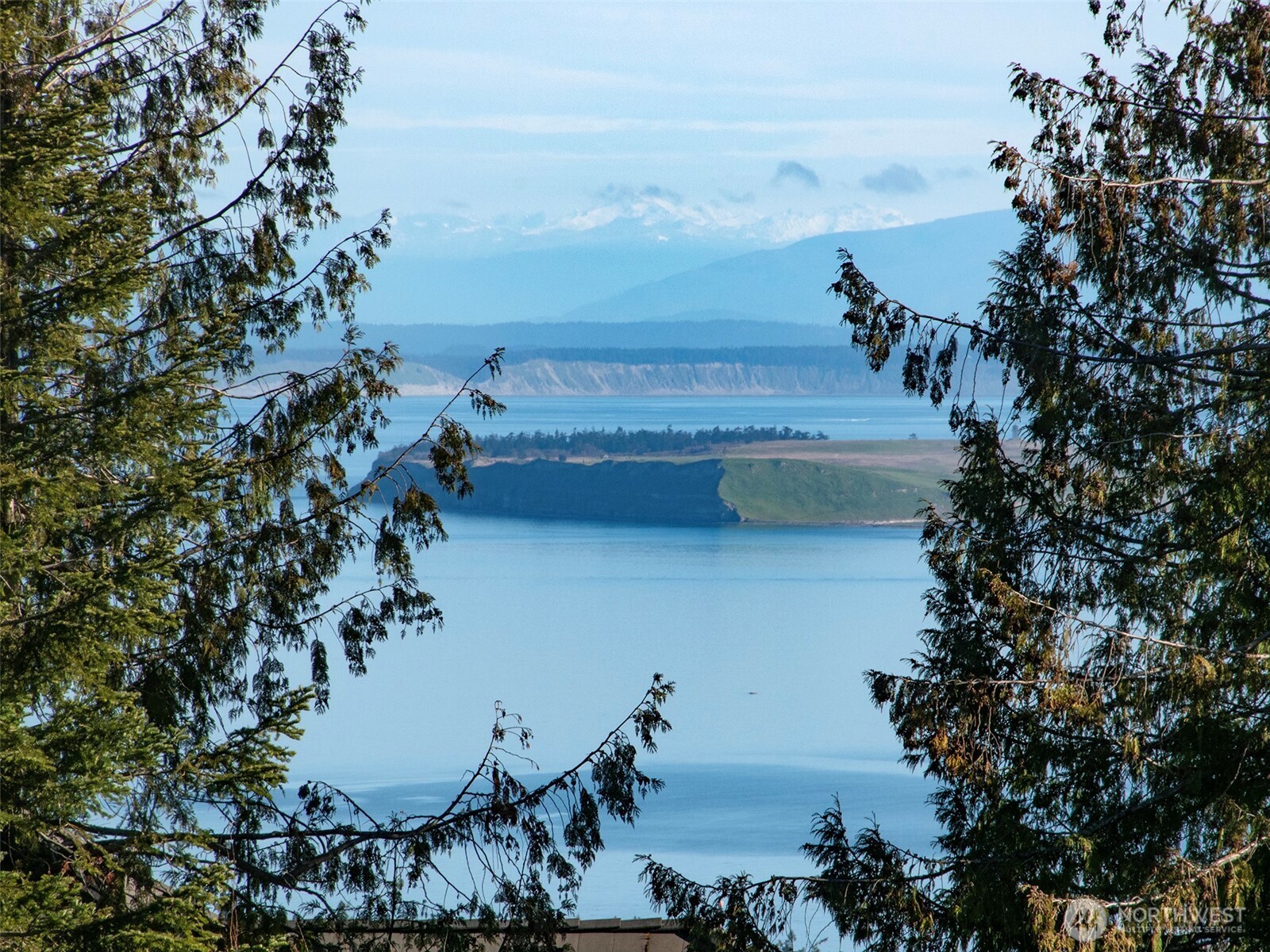 9999 Doe Run Road Sequim, WA 98382 - Photo 11 of 36 a view of a terrace with a garden