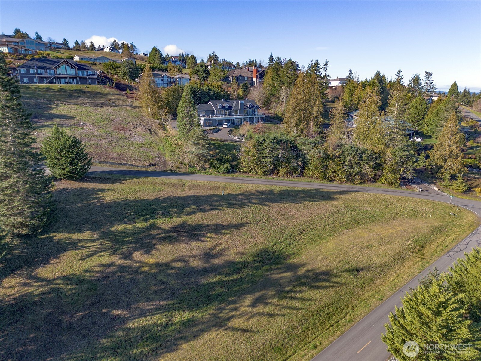 9999 Doe Run Road Sequim, WA 98382 - Photo 18 of 36 a view of a lake with houses