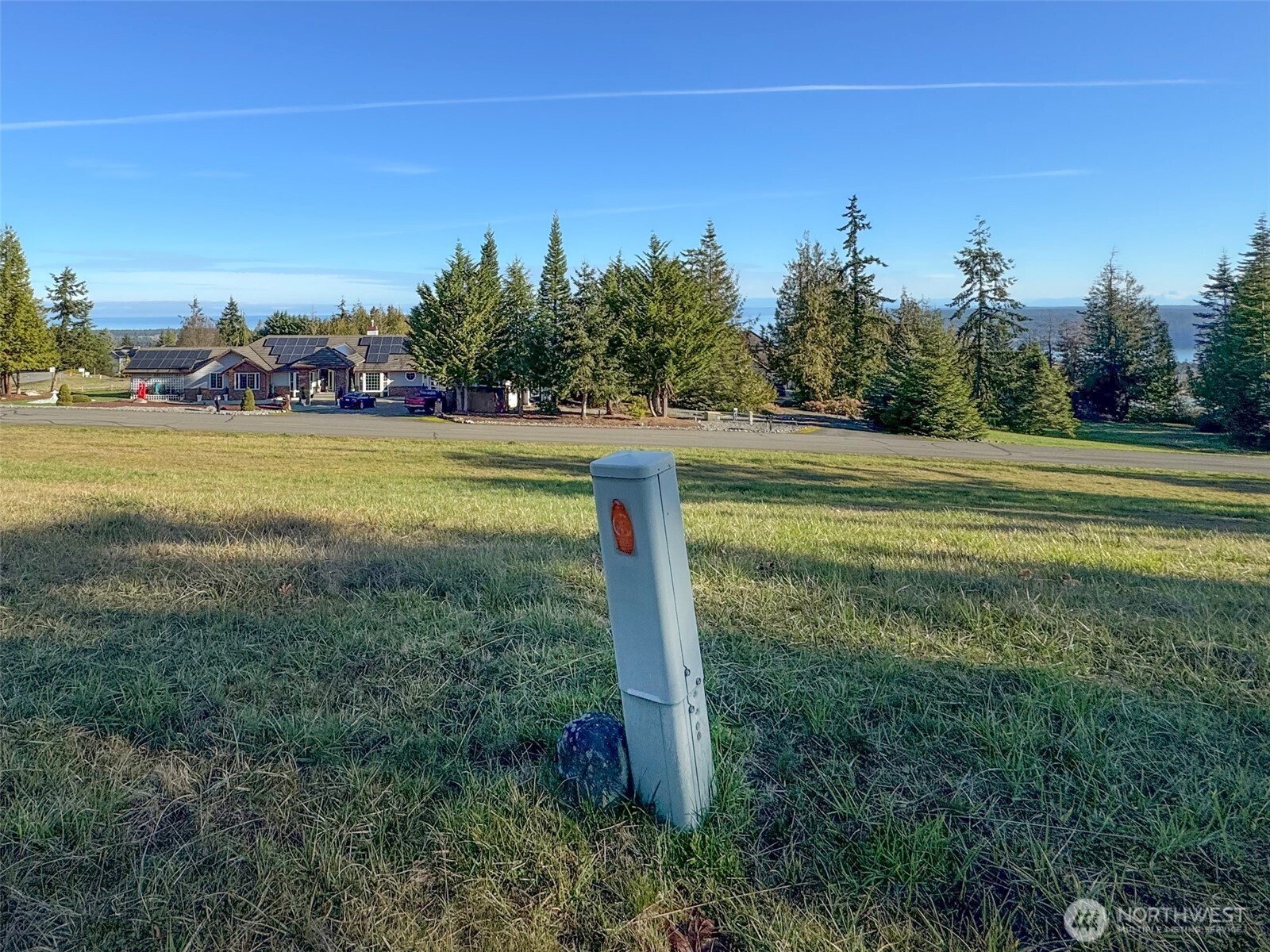 9999 Doe Run Road Sequim, WA 98382 - Photo 25 of 36 a view of a field with trees in the background