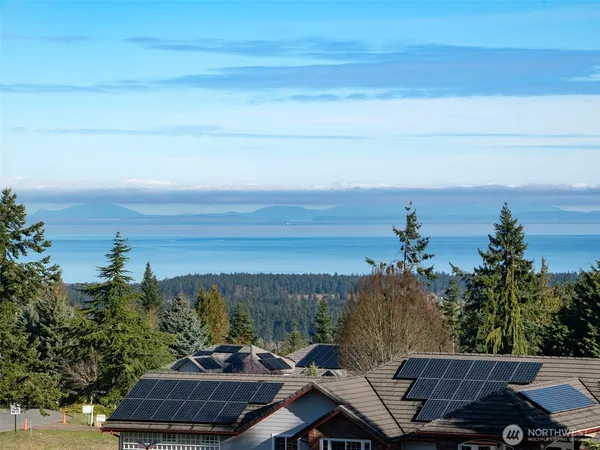 an aerial view of a house with mountain view