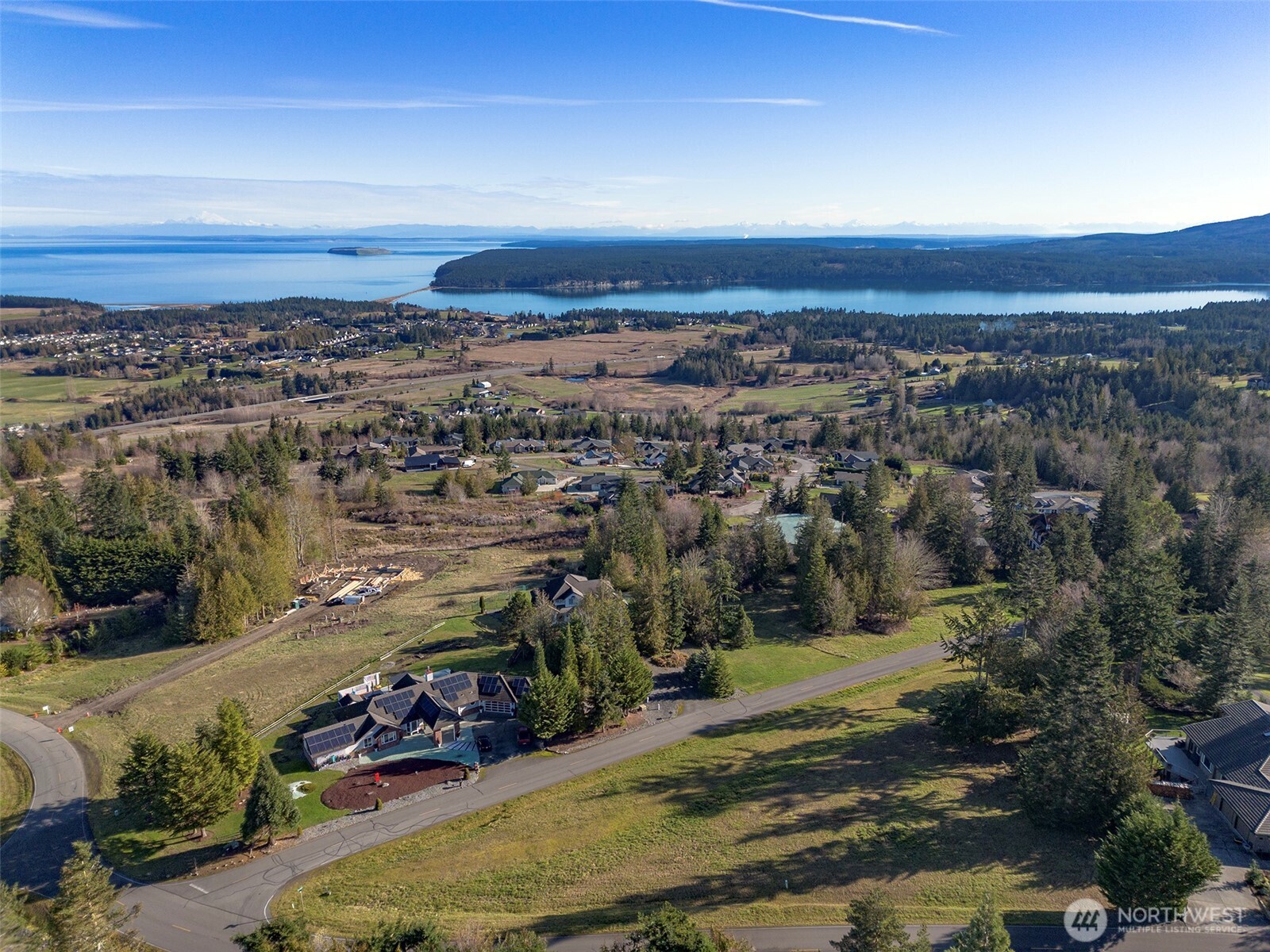 9999 Doe Run Road Sequim, WA 98382 - Photo 10 of 36 an aerial view of residential building and ocean view