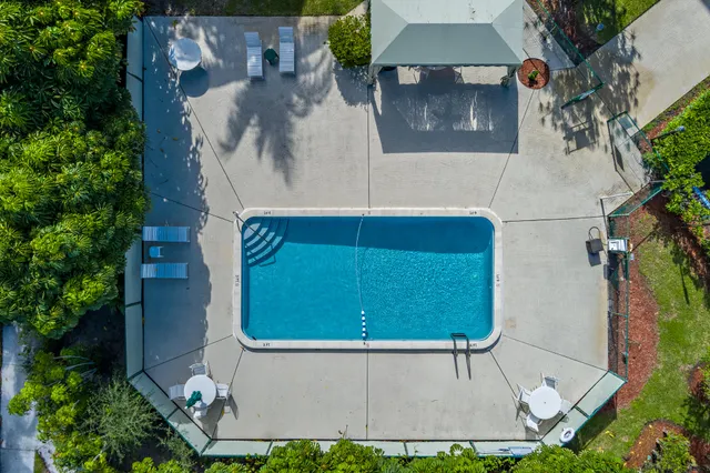 a view of a swimming pool with a patio