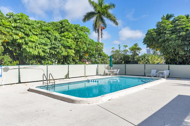 a view of a swimming pool with a patio