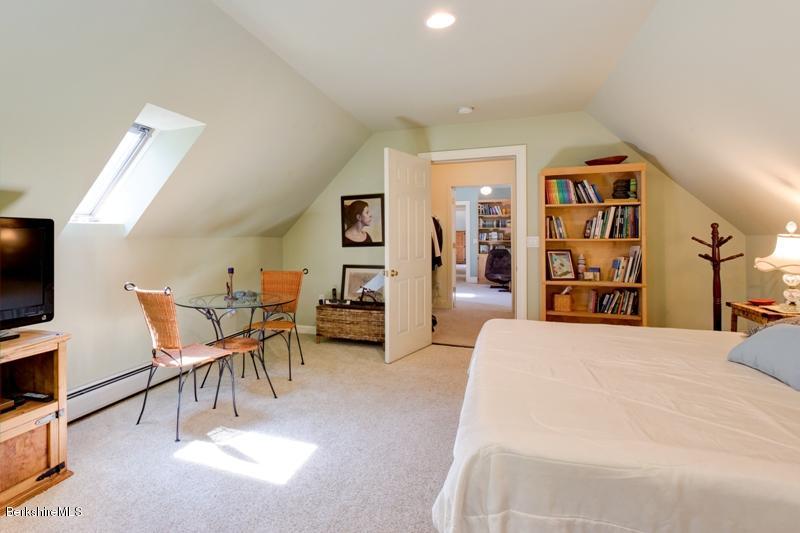 881 South Undermountain Road Sheffield, MA 01257 - Photo 22 of 30 a bed room with a bed and a chair