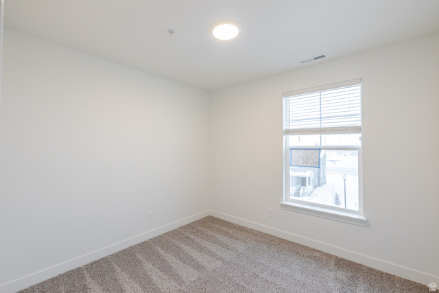 709 West 4500th South, Unit N301 Mapleton, UT 84664 - Photo 9 of 17 Empty room with baseboards and light colored carpet