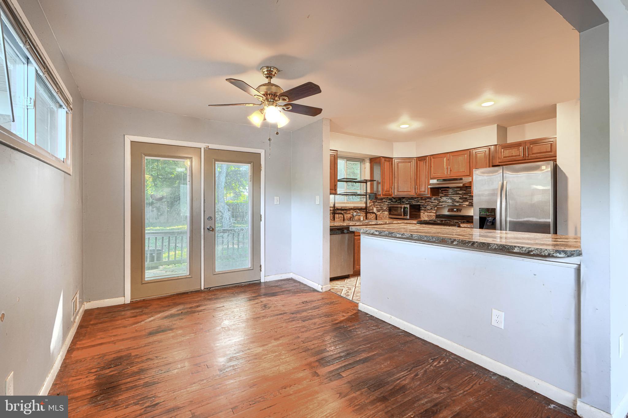 9706 Liberty Road Randallstown, MD 21133 - Photo 15 of 43 a view of a kitchen with a sink and a window