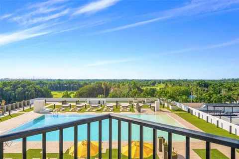a view of swimming pool with a balcony