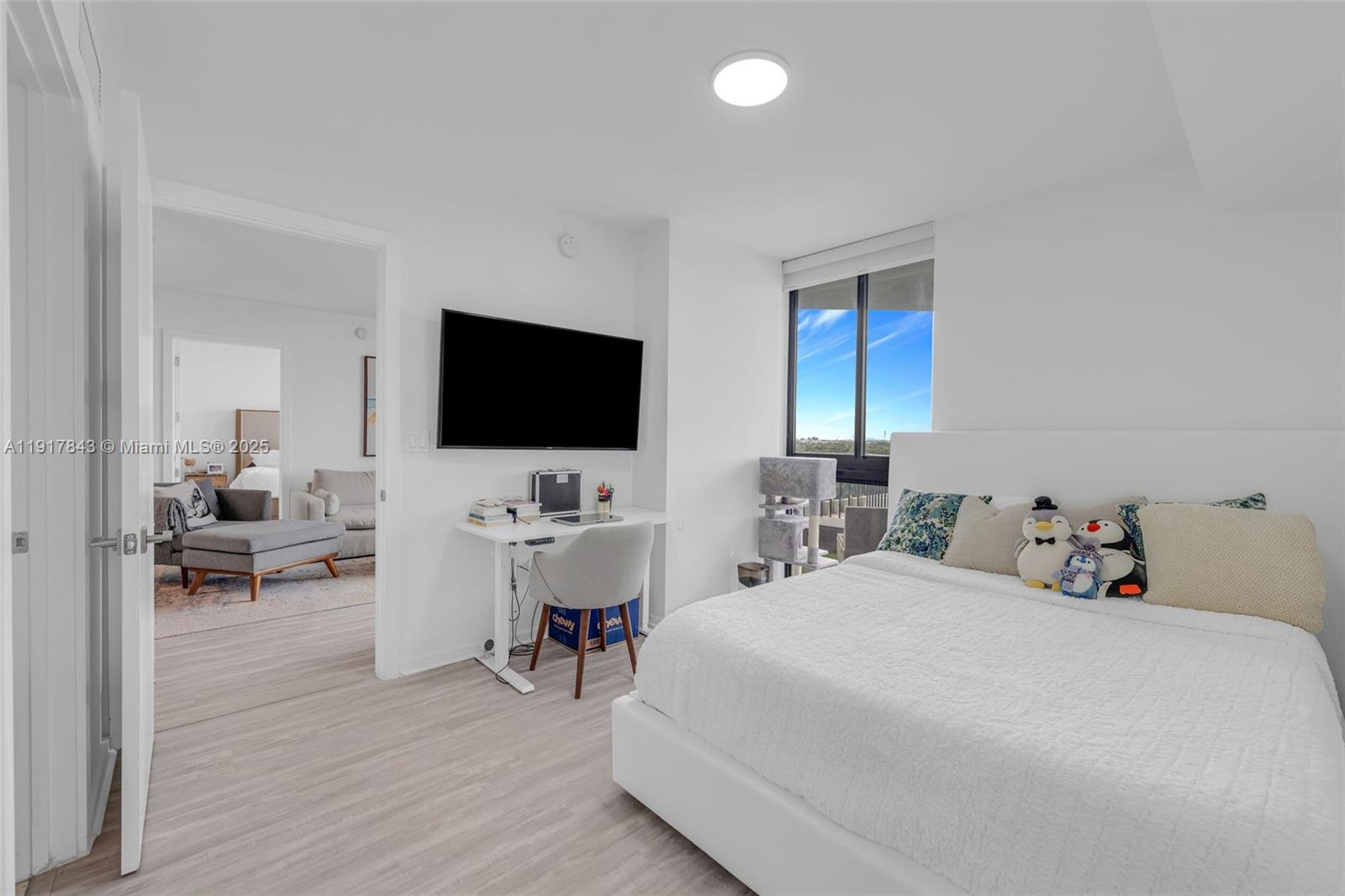 5252 Northwest 85th Avenue, Unit 504 Doral, FL 33166 - Photo 15 of 31 a view of a livingroom with furniture and a flat screen tv