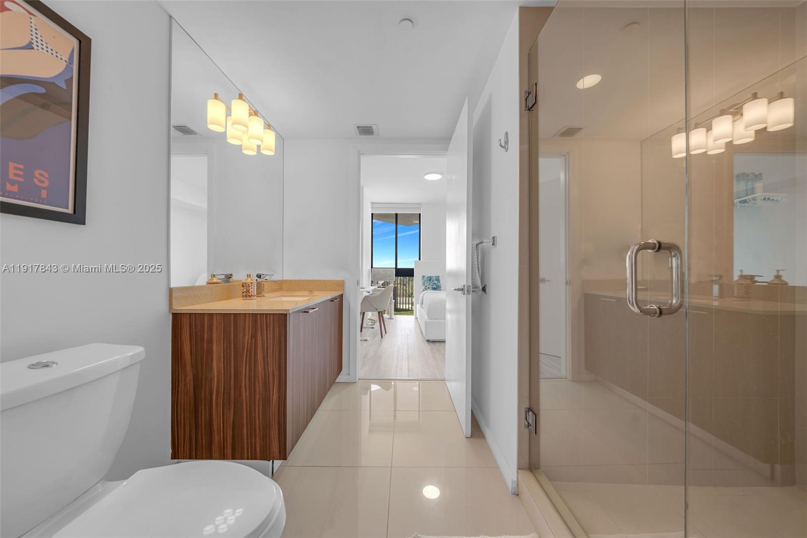 5252 Northwest 85th Avenue, Unit 504 Doral, FL 33166 - Photo 16 of 31 a bathroom with a sink a toilet and shower