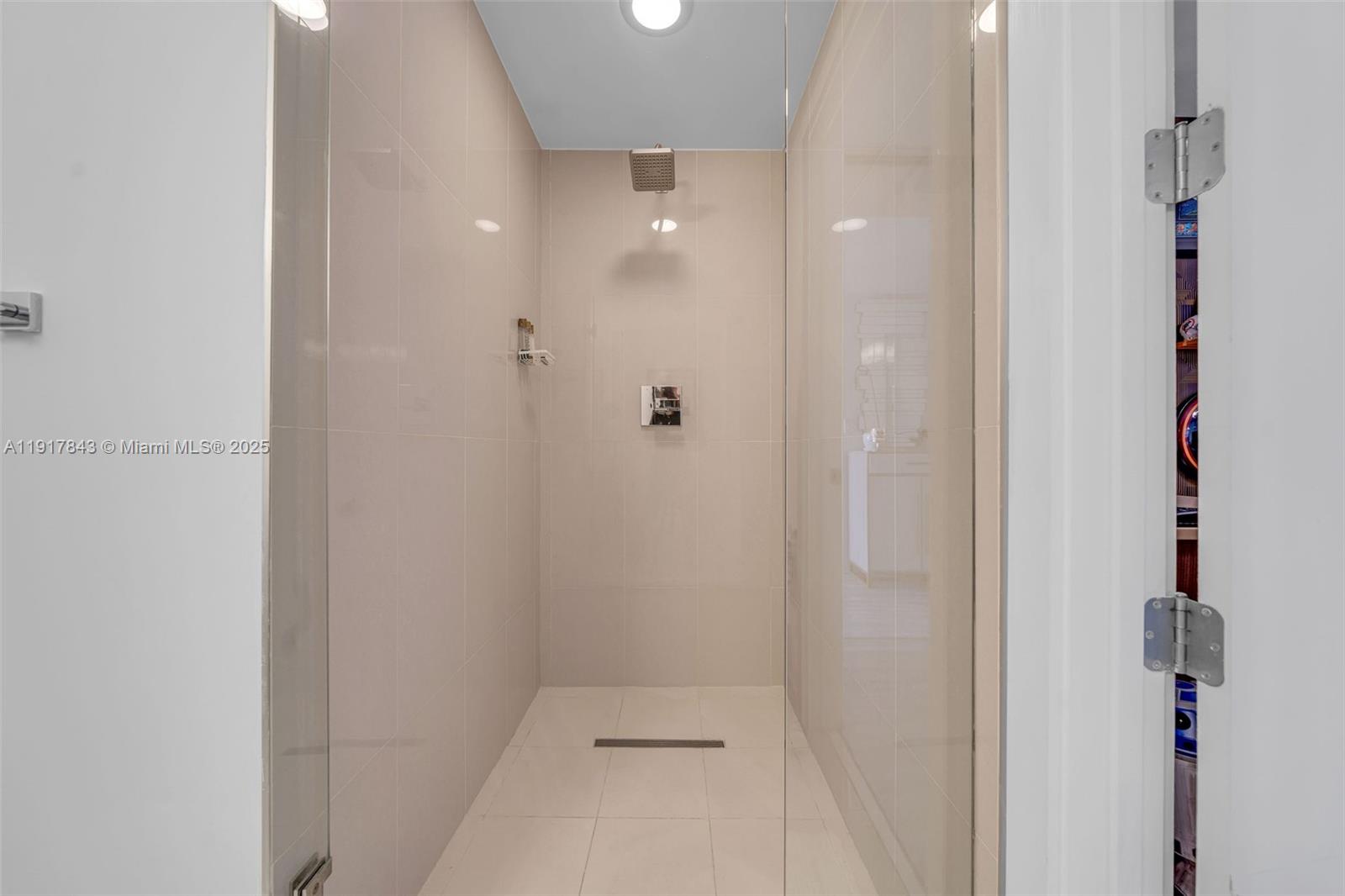 5252 Northwest 85th Avenue, Unit 504 Doral, FL 33166 - Photo 17 of 31 a bathroom with a shower