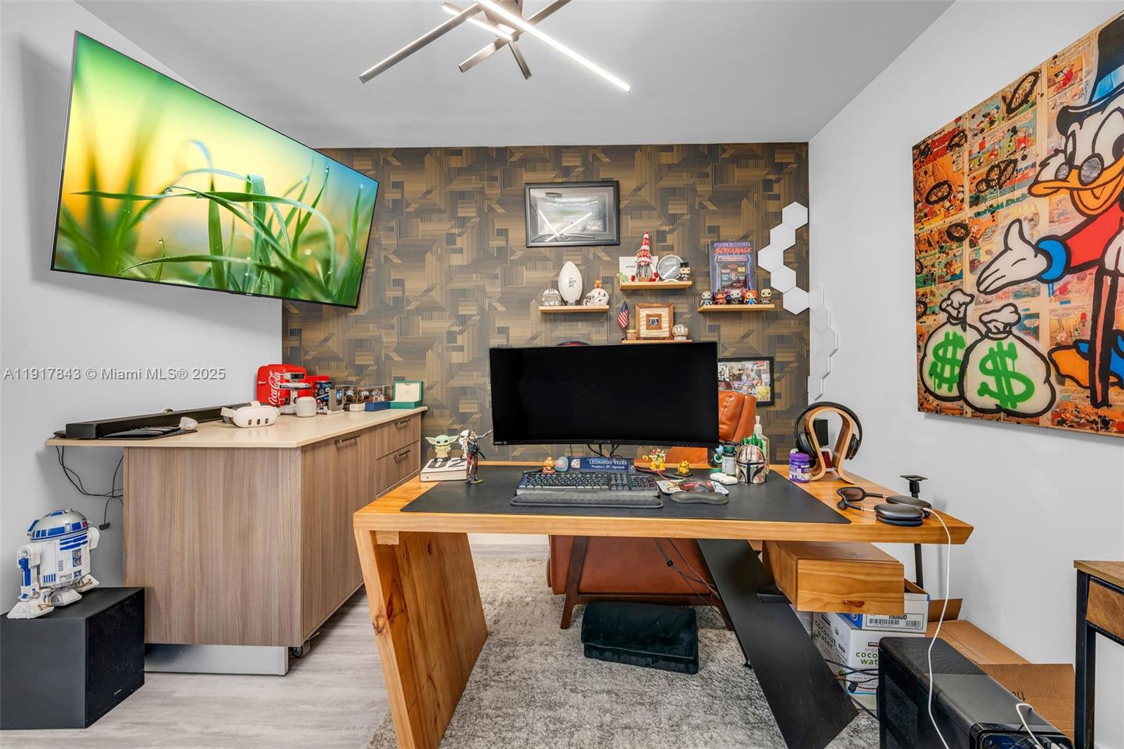 5252 Northwest 85th Avenue, Unit 504 Doral, FL 33166 - Photo 23 of 31 a living room with furniture and a flat screen tv