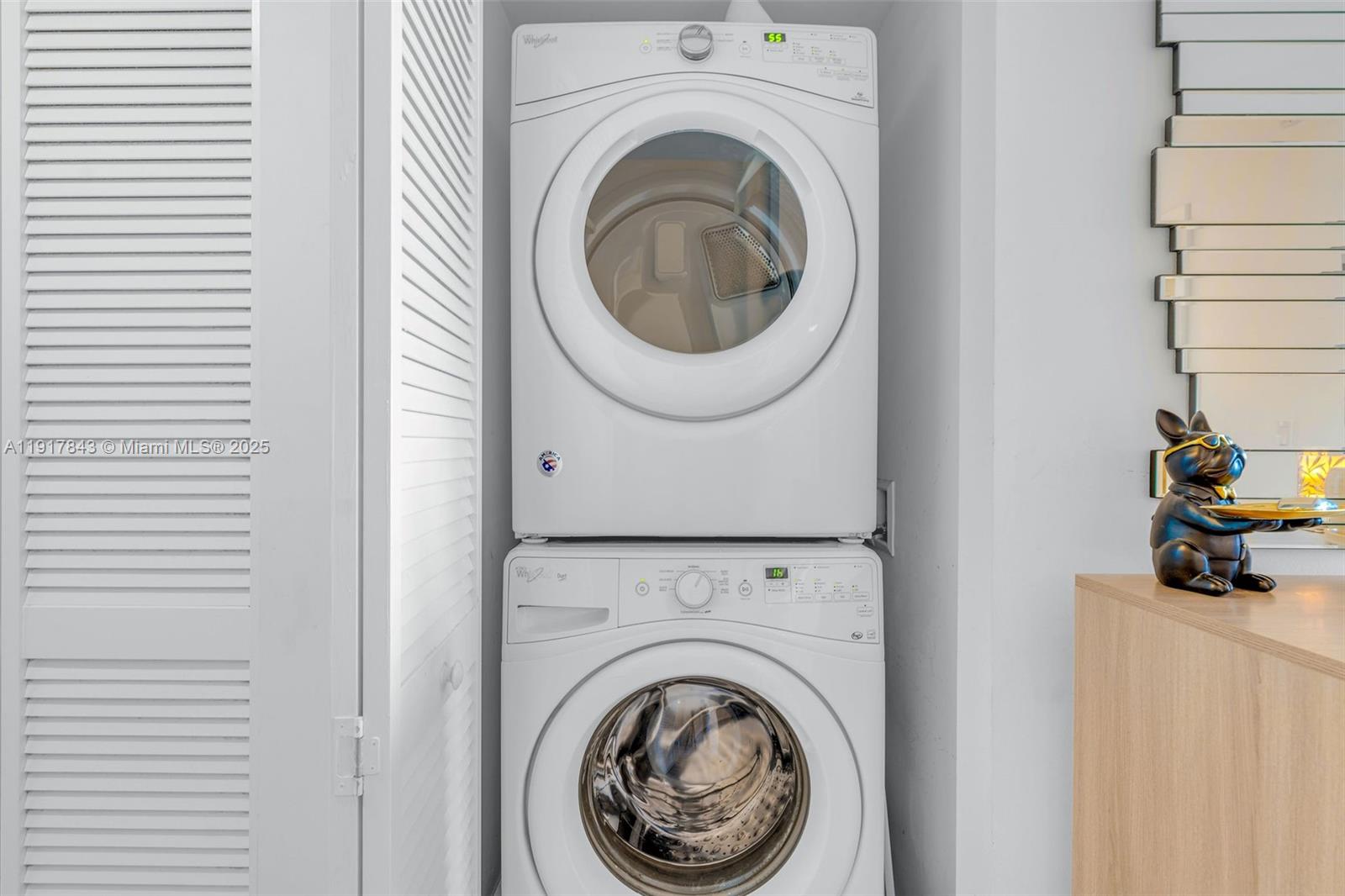 5252 Northwest 85th Avenue, Unit 504 Doral, FL 33166 - Photo 25 of 31 a view of a hallway with washer and dryer