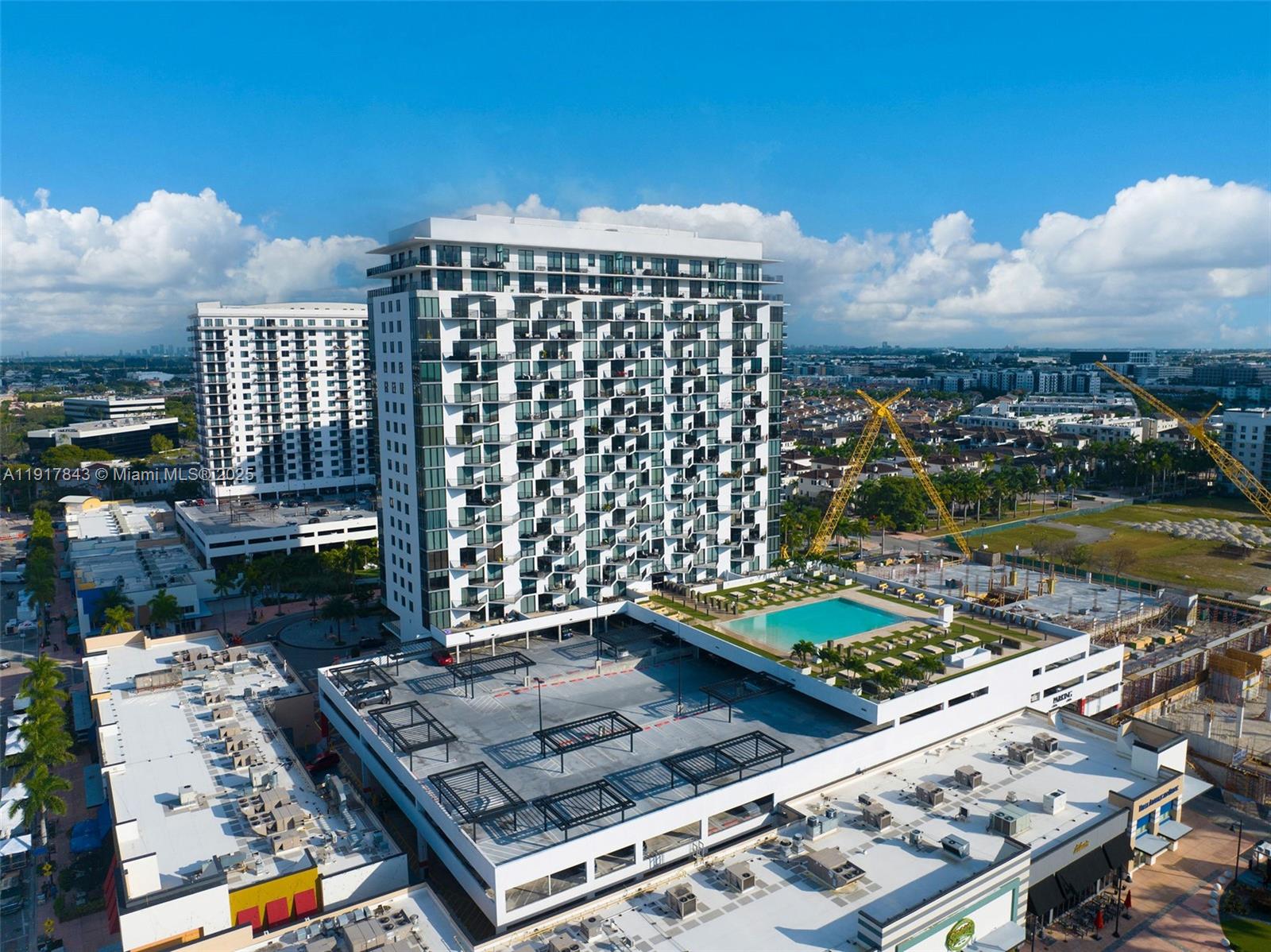 5252 Northwest 85th Avenue, Unit 504 Doral, FL 33166 - Photo 27 of 31 a view of a city from a balcony